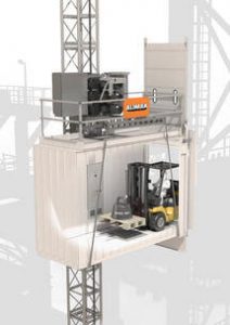 An industrial elevator that's moving a forklift between levels