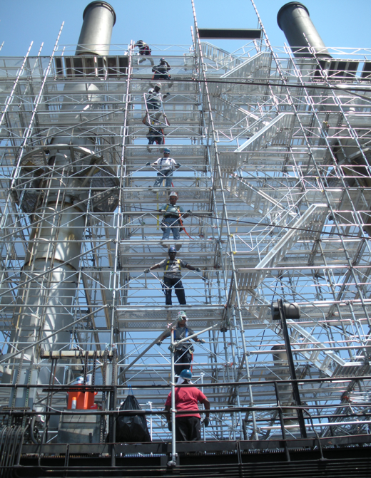 team of workers prevents scaffolding hazards