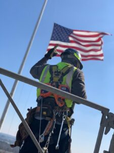 Man standing on scaffolding wearing safety gear