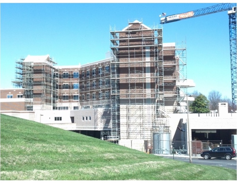 Scaffolding over a wing of a hospital building.