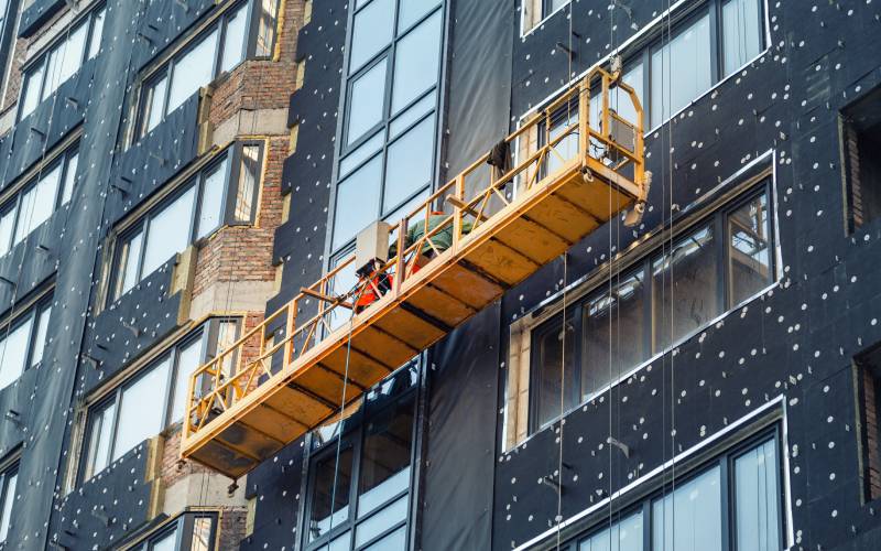 Suspended scaffolding on a commercial building